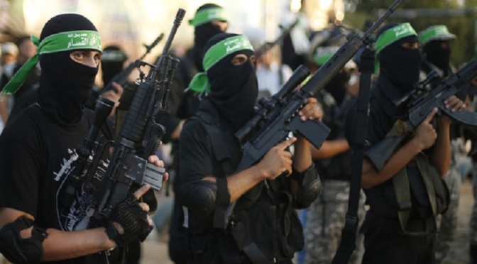 Hamas militants march during a rally in memory of people who were killed during a seven-week Israeli offensive, in Gaza City September 26, 2014. An open-ended ceasefire between Israel and Hamas-led Gaza militants, mediated by Egypt, took effect on August 26 after the seven-week conflict. It called for an indefinite halt to hostilities, the immediate opening of Gaza's blockaded crossings with Israel and Egypt, and a widening of the territory's fishing zone in the Mediterranean. REUTERS/Suhaib Salem (GAZA - Tags: POLITICS CIVIL UNREST MILITARY) - RTR47UY7